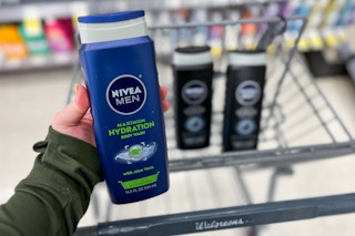 hand holding nivea men body wash over walgreens cart