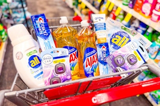 all detergent, crest toothpaste, ajax dish soap, gold bond lotion, and febreze car air fresheners in a cart