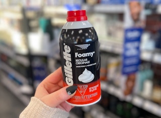 hand holding Gillette Foamy shave cream can