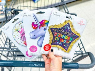 balloons being help by walgreens cart 