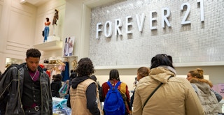 People waiting in line to checkout at a Forever 21 store