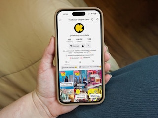 someone holding up a phone displaying the krazycouponlady tiktok account page