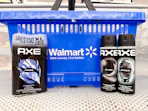 3 axe sprays sitting in front a walmart shopping basket