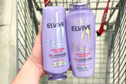 hand holding L'Oreal Elvive products