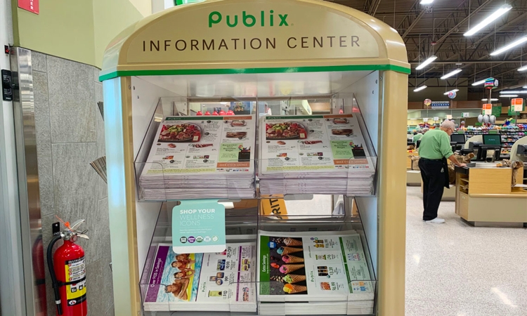 Display holding stacks of Publix ads and Publix circulars
