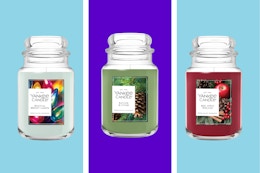 Collection of large Yankee candles.