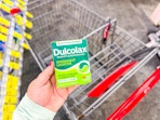 hand holding dulcolax tablets in cvs