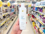 hand holding dove shampoo in walgreens