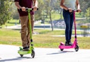 green and pink electric scooters