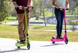 green and pink electric scooters