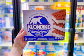 hand holding a box of klondike bars