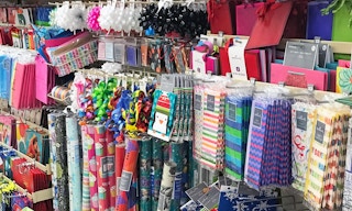 Hallmark aisle shot with gift bags, tissue paper, wrapping paper, ribbons and more