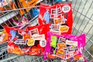 large bags of halloween candy in a cart