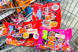large bags of halloween candy in a cart