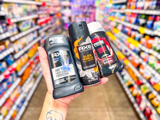 hand holding axe cherry phoenix black vanilla deodorant in walmart aisle