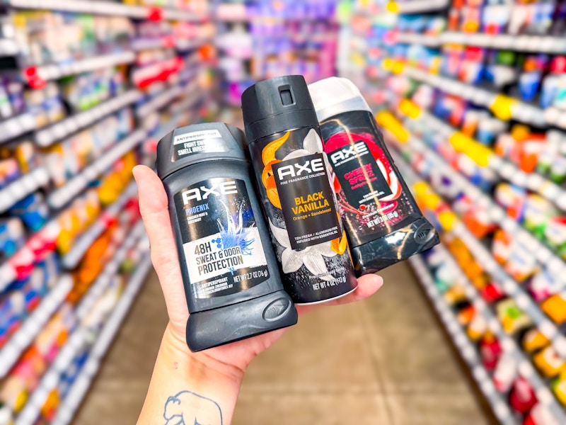 hand holding axe cherry phoenix black vanilla deodorant in walmart aisle