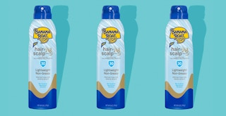 The recalled Banana Boat Hair and Scalp aerosol sun screen on a teal background
