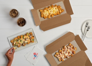 Dominos new loaded tots come in three different flavors, displayed here.