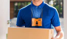 a person with a fan around their neck carrying a box