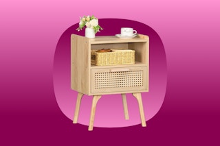 A light wood-grain side table with legs and one rattan drawer