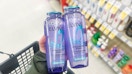 person holding loreal elvive shampoo bottles