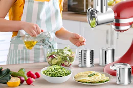 woman making salad with attachment