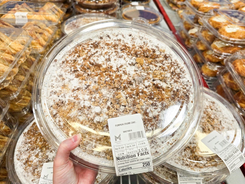 person holding a pumpkin crumb cake