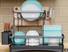 a dish drying rack on a kitchen counter with dishes