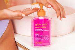 a person pumping tanning gel out of a bottle
