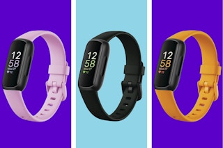 Three Fitbit Inspire 3s with pink, black, and yellow bands, respectively