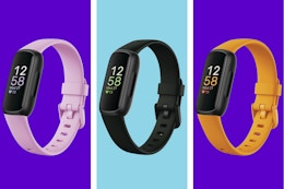 Three Fitbit Inspire 3s with pink, black, and yellow bands, respectively