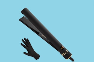 flat iron and glove on blue background