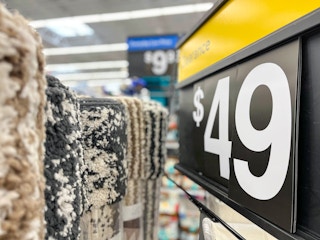 $49 clearance sign placed by Mainstays Shag Area Rugs at Walmart