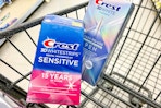 shopping cart with 2 crest teeth whitening products