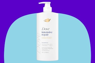 Dove intensive shampoo on a blue background.