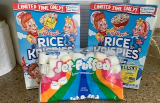two boxes of limited edition rice krispies and one bag of jet-puffed marshmallows on countertop