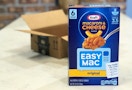 A box of Kraft Easy Mac in front of an open Amazon box.