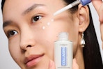 a woman using loreal collagen serum