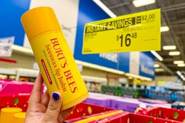 hand holding burts bees mega lip balm