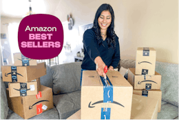 a woman opening up amazon boxes