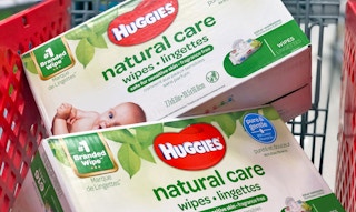 Two boxes of Huggies baby wipes in a shopping cart.