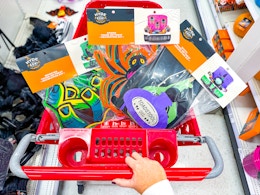 3 target trunk or treat kits sitting in a target cart