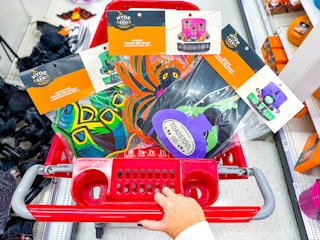 3 target trunk or treat kits sitting in a target cart