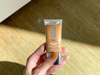 hand holding up clinique foundation