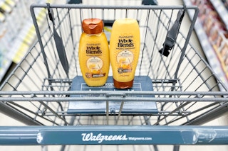 two bottles of Garnier Whole Blends Honey Treasures hair care inside shopping cart