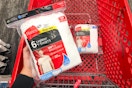 hand holding hanes men's t-shirt pack over a target cart