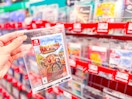 Nintendo Switch game held up in video game aisle at Walmart