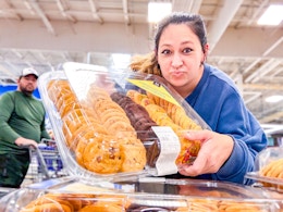 person holding a members mark cookie tray