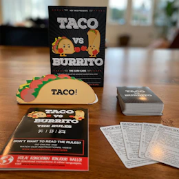 Taco vs Burrito game on a wooden table