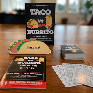 Taco vs Burrito game on a wooden table